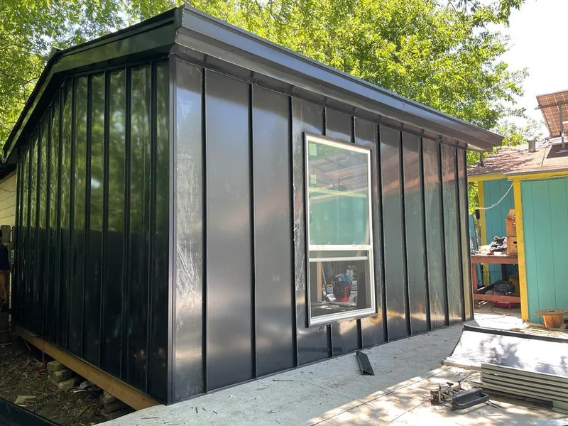 Black standing seam metal wall panels for Roof Inspection in Depew